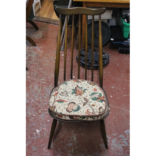 175 - A stunning vintage Ercol dining room table and six chair set.