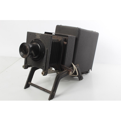 185 - A vintage Newton & Co Ltd magic lantern projector with wooden slide carrier and slides.