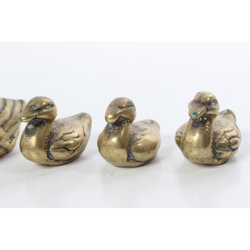 189 - A set of four vintage brass ornamental ducks and another swann.