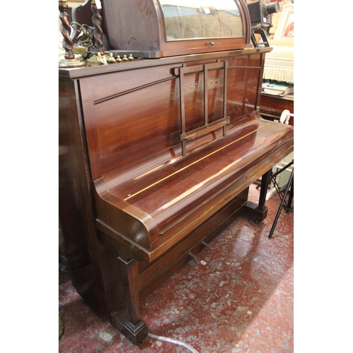 190 - A Russell & Russell upright piano.