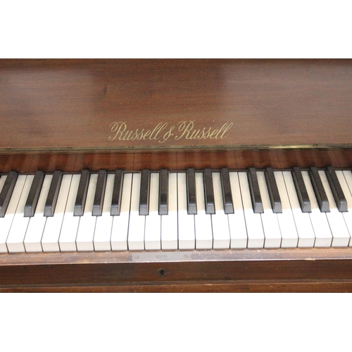 190 - A Russell & Russell upright piano.