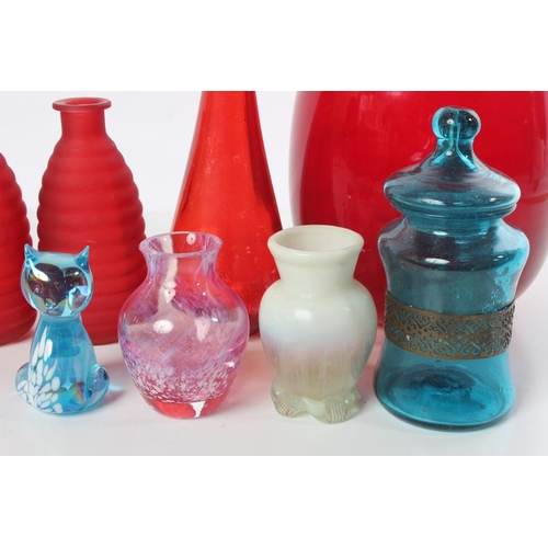 193 - A blue glass cat, an antique cream glass vase and more.