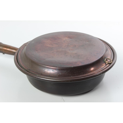 196 - An antique copper bed pan.