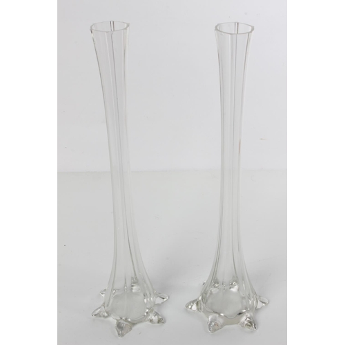 197 - A pair of tall clear glass bud vases.