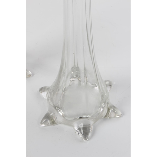 197 - A pair of tall clear glass bud vases.