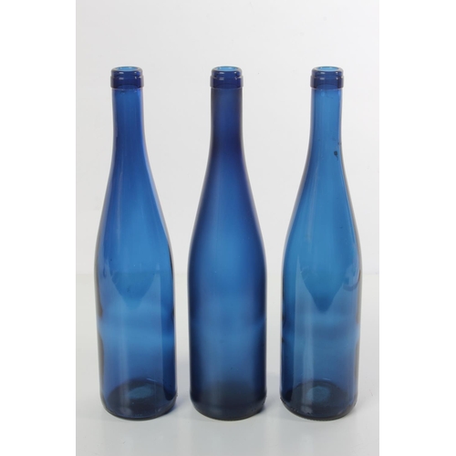 199 - Three blue glass bottles.