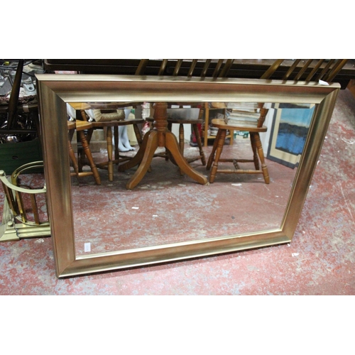 201 - A large gilt framed wall mirror.