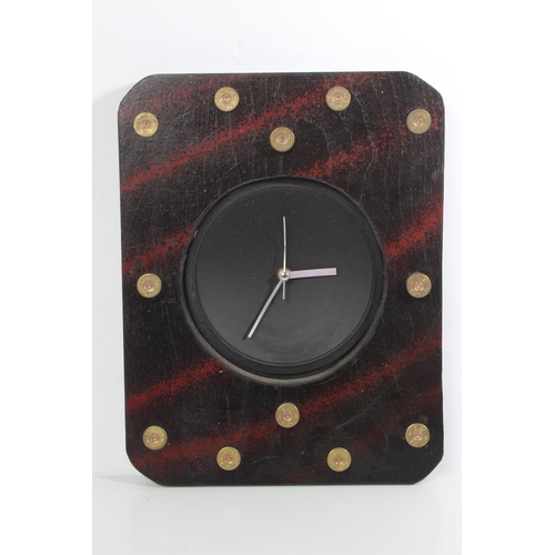 207 - An unusual wall clock with brass cartridge shell cases.