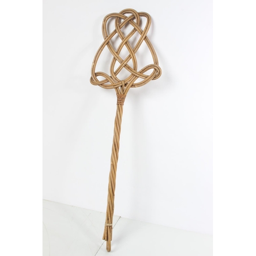 219 - A vintage carpet beater.