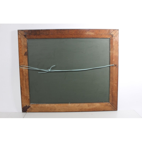 221 - An oak framed wall mirror with carved detail to frame.