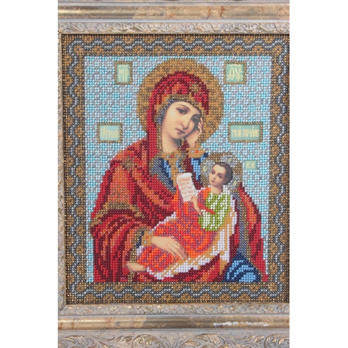 225 - A stunning needlework and bead religious picture.