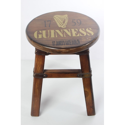 230 - A small wooden 'Guinness' stool'.