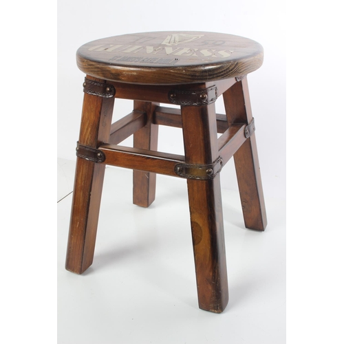 230 - A small wooden 'Guinness' stool'.