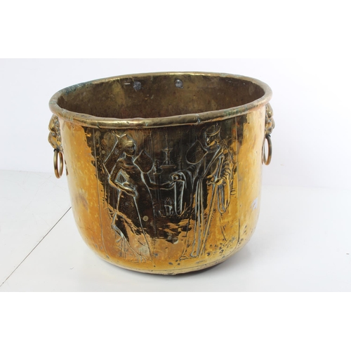 236 - A stunning large antique brass coal bucket with lion mask handles.