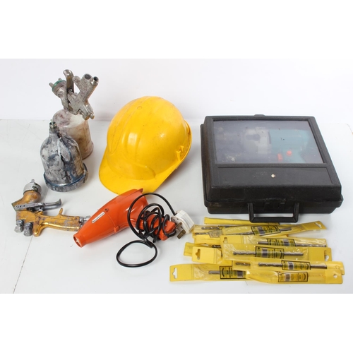 244 - A builders hard hat, a lot of new drill bits, a cased drill and more.