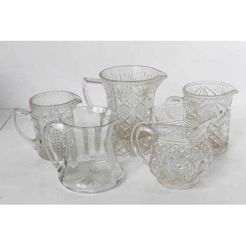 287 - A collection of five vintage glass water jugs.