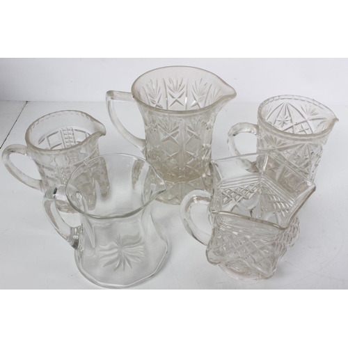 287 - A collection of five vintage glass water jugs.