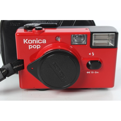 302 - A vintage Konica camera and case.