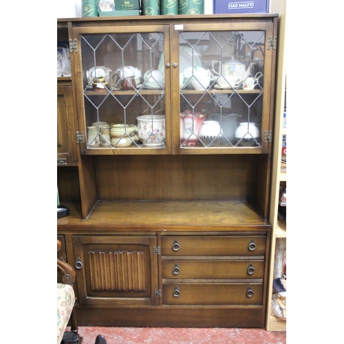 313 - A vintage oak sideboard/dresser with leaded glass door panels.