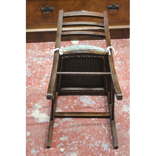 314 - A vintage oak single chair with rattan upholstered seat.