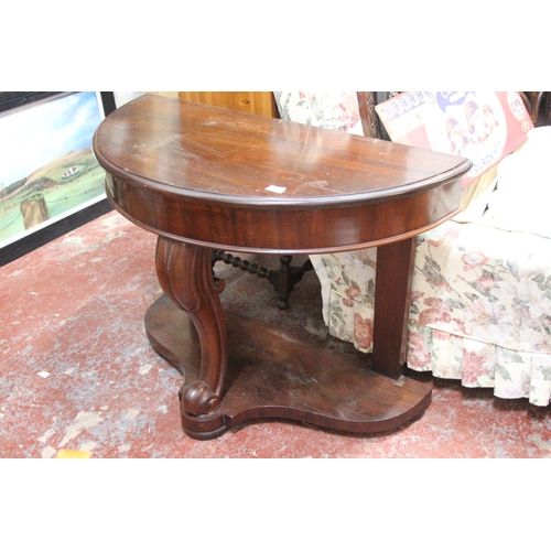 371 - An antique mahogany demi lune table.