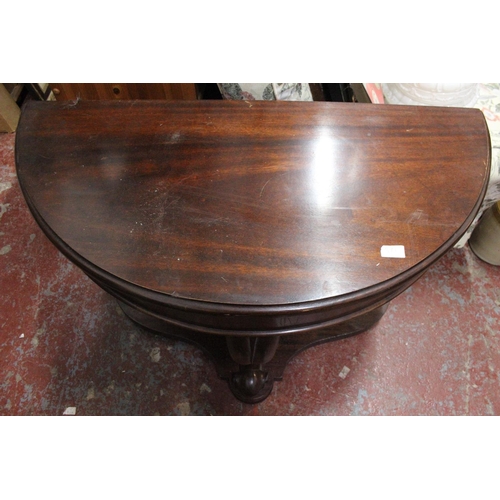 371 - An antique mahogany demi lune table.