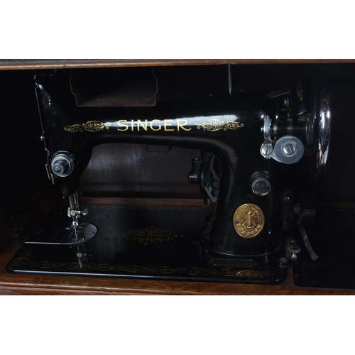 391 - A vintage Singer sewing machine and case.