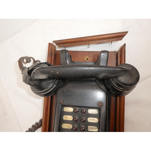 415 - A wall mounted antique style housemaids telephone.