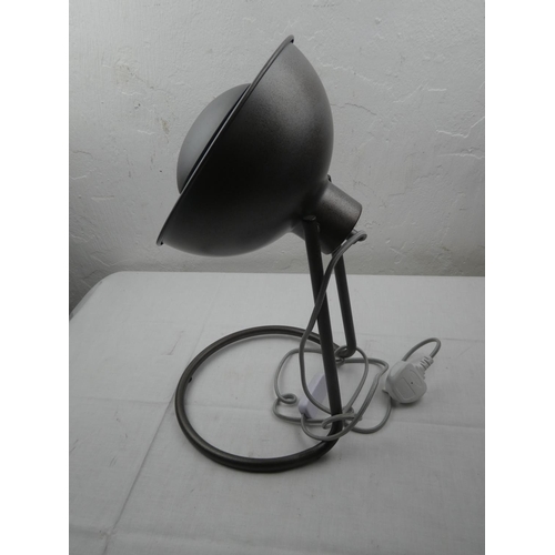 422 - A table lamp on a metal stand.