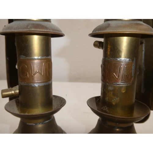 426 - A pair of brass 'GWR' candleholders.