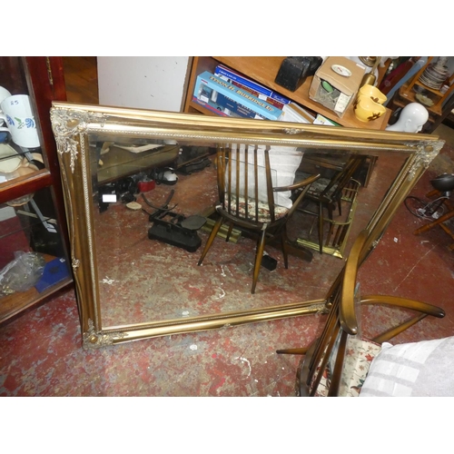 434 - A large gilt framed wall mirror, measuring 51