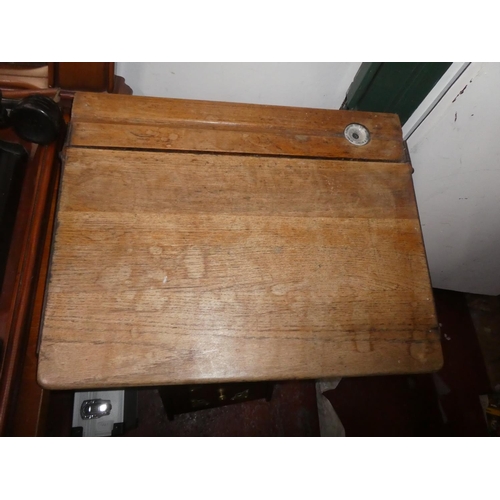 440 - An antique child's school desk with original ceramic inkwell.