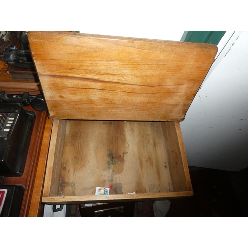 440 - An antique child's school desk with original ceramic inkwell.