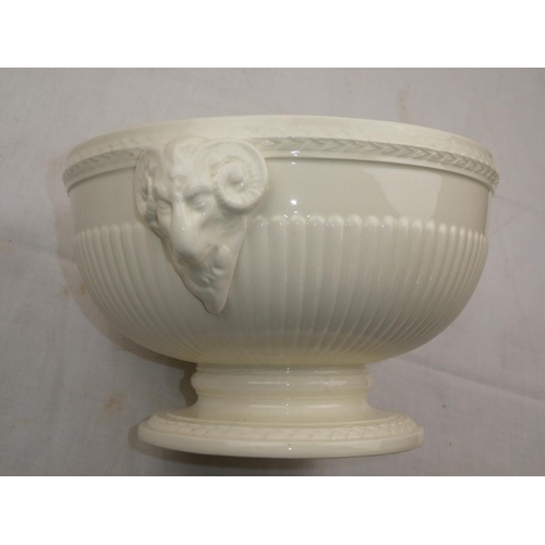 448 - A cream glazed bowl with rams head detail.