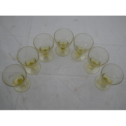 478 - A set of seven coloured stem glasses.