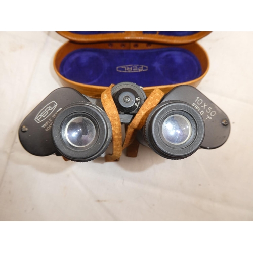 485 - A vintage leather cased set of Perl binoculars and compass.