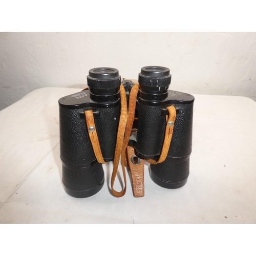 485 - A vintage leather cased set of Perl binoculars and compass.