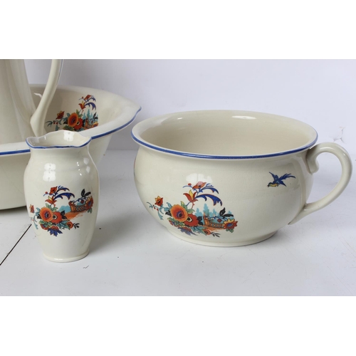 213 - A vintage Empire Ware 'Merry Glaze' jug and basin set, chamber pot and tooth brush holder.