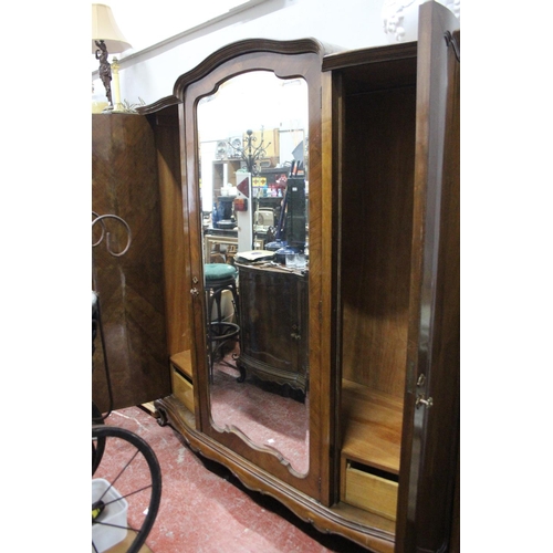 351 - A stunning large antique mahogany two door wardrobe with mirror panel.