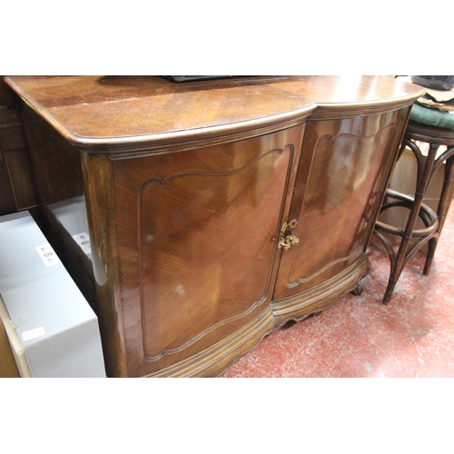 351B - A stunning antique mahogany two door cupboard with curve doors, on ball and claw feet, with four pul... 