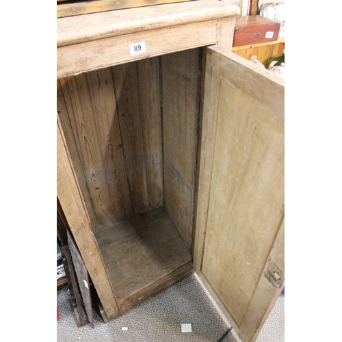 89 - An antique pine single door cabinet.