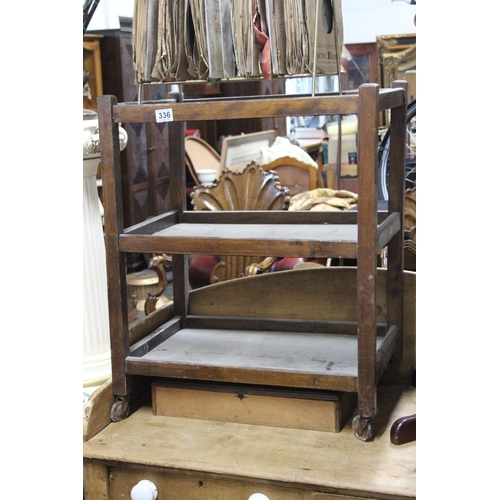 336 - A vintage wooden drinks trolley.