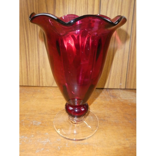 463 - A large cranberry glass vase.