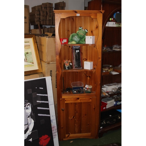 25 - A pine corner cabinet.