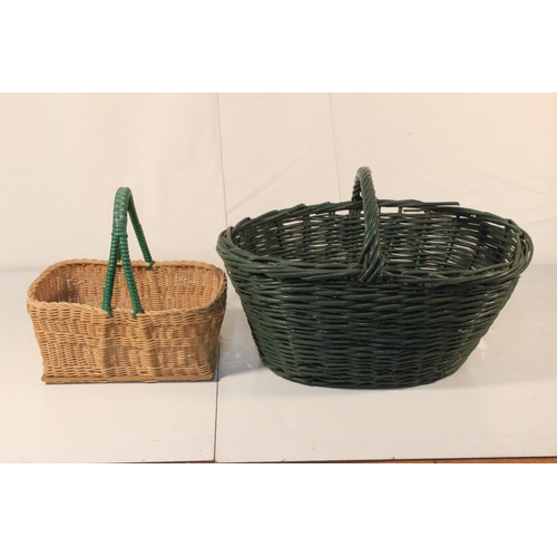 29 - A vintage green rattan shopping basket and another.