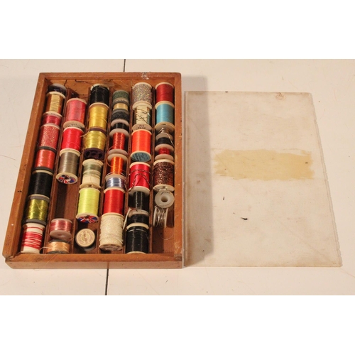52 - A wooden case containing large assortment of fly tying tinsels.
