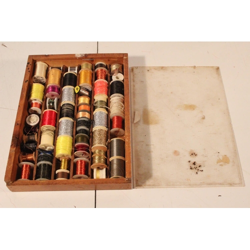 55 - A wooden case containing large assortment of fly tying tinsels.
