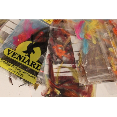 79 - A lot of assorted packs of dyed feathers & fly tying material.