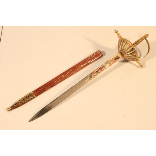 92 - An ornamental miniature sword and leather scabbard.