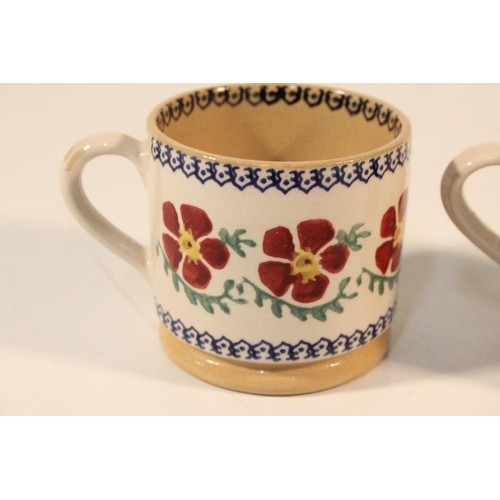 98 - Two Nicholas Mosse pottery cups.